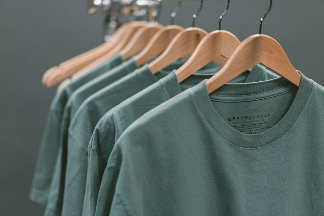 A row of blank T-shirts ready for custom printing